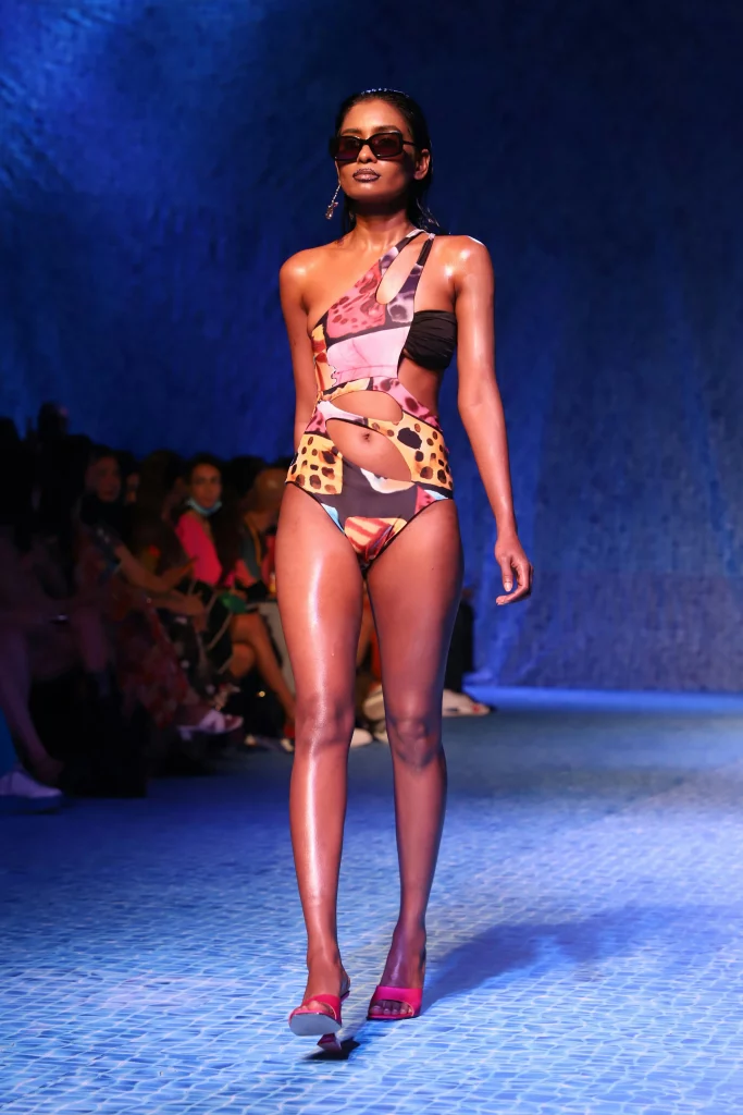 The image displays a woman wearing a bikini, pumps, and sunglasses. Copyright Rajesh Kumar Verma/Pexels.