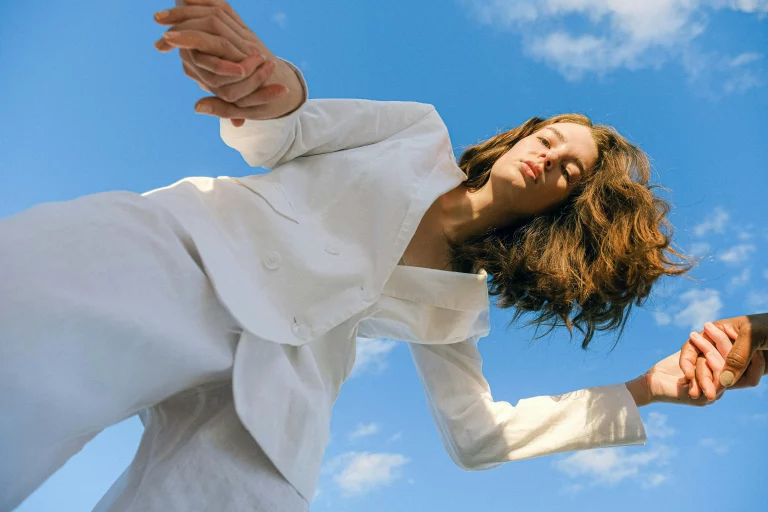 The image displays a woman wearing a white suit. Copyright Anna Shvets/Pexels.