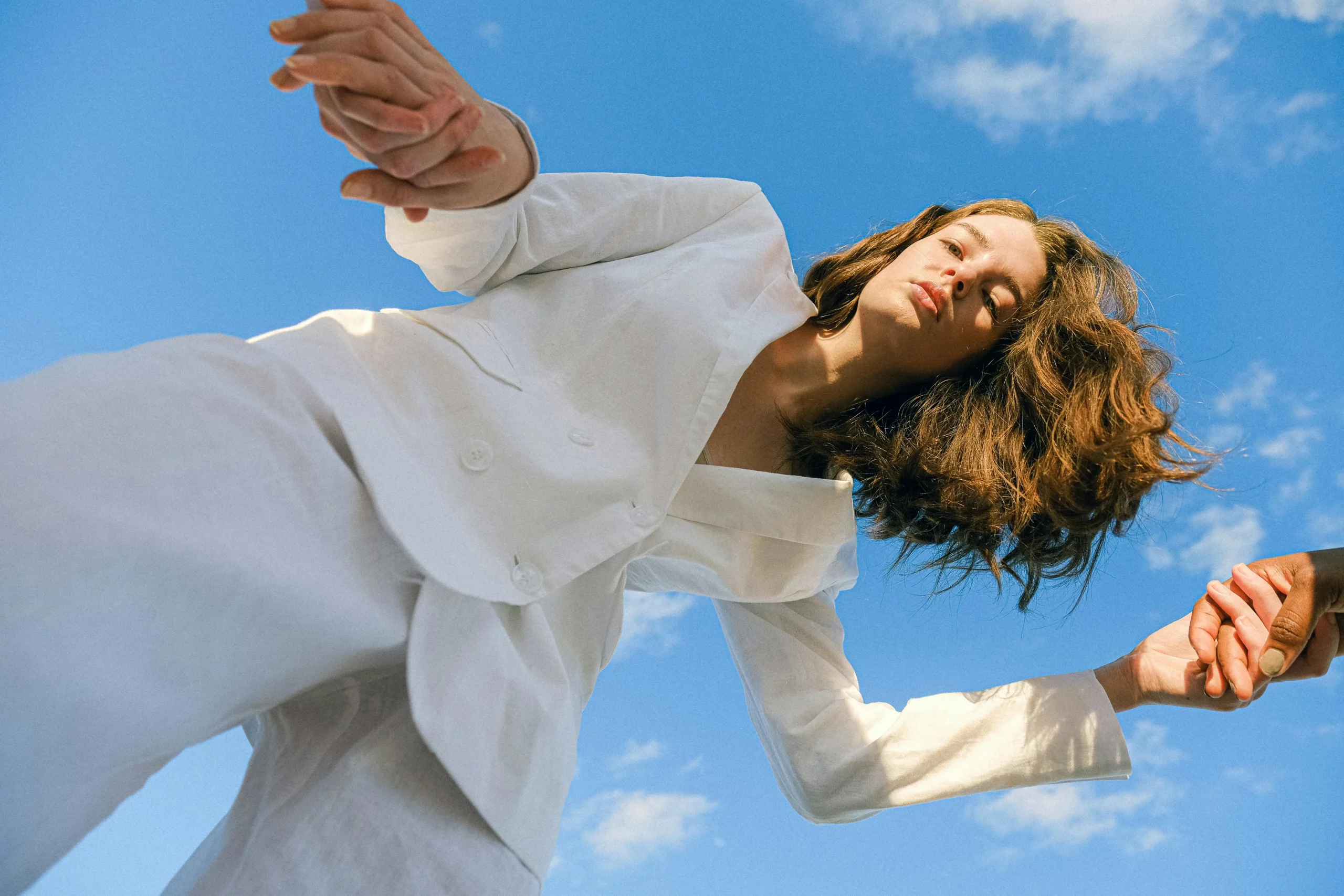 The image displays a woman wearing a white suit. Copyright Anna Shvets/Pexels.